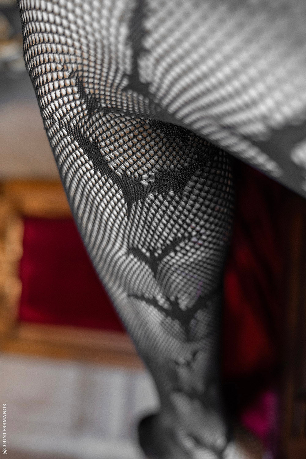 Asymmetric Bat Fishnet Tights